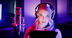 Woman, neon or mic with tablet for podcast, live streaming or online broadcast in production studio. Female person, producer or host working late with technology, app or headphones for radio service