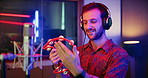 Microphone, tambourine and musician in music booth with headphones for recording song with talent. Singer, instrument and male artist singing with audio tech for production on album in sound studio.