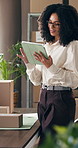 Boxes, tablet and thinking with woman in logistics plant for management of shipping schedule. App, reading and scrolling with employee person in supply chain office for delivery or distribution