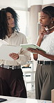 Tablet, checklist and planning with ecommerce team for delivery schedule, supply chain or inventory. African women, discussion and tech in logistics office, distribution idea and clipboard for stock