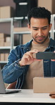 Businessman, phone and picture with box for logistics, online delivery or shipping stock in office. Man, employee or distributor checking packages with mobile smartphone or laptop for supply chain