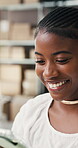 Ecommerce, woman and reading in office with tablet, smile or positive feedback for shipping logistics. Happy, black person and tech in workplace with good news, distribution update or small business.