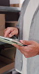 Tablet, hands and man in office with boxes for delivery, logistics and ecommerce order. Digital technology, cargo and professional supply chain manager with online shipping information in workshop.