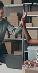 Celebration, people and high five with laptop for delivery, distribution or quality control for ecommerce. Small business, warehouse and collaboration for supply chain, shipping or supplier sales
