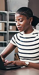 Typing, black woman and order with laptop for delivery, distribution or quality control for ecommerce. Small business, warehouse and supply chain owner for planning, shipping or supplier checklist