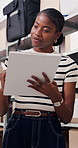 Tablet, pen and black woman in office with boxes for delivery, logistics and ecommerce order. Digital technology, stylus and African female supply chain manager with online shipping information.