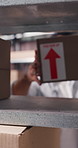 Box, packing and shelf with man in logistics office for distribution, shipping or storage. Arrow label, inventory and package with person in supply chain warehouse for delivery, instructions or stock