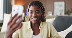 Black woman, phone and happy with video call in home, talk and explain with funny story in living room. African person, smartphone and smile with mobile app, contact and chat on social media at house