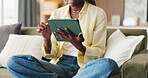 Relax, scroll and hands with tablet on couch, browsing website and internet search for ebook app download. News platform, social media and woman with tech for weekend entertainment, chill and home