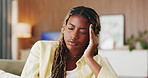 Headache, tired and black woman in living room with massage, frustrated or tension with discomfort. Pain, fatigue and female person in house with migraine, inflammation or sore head with dizziness. 