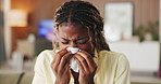 Black woman, tissue and blowing nose on sofa in home with stress, illness or flu in living room. African person, frustrated and fatigue with cold, virus and sick on couch with napkin at apartment