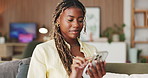 Laugh, browse and black woman in house with phone, online communication and comic post on social media. Happy, digital and person on sofa with tech, funny text message or meme reaction on chat app.