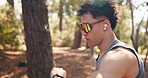 Smart watch, fitness and man in forest, running performance and digital app to track progress. Outdoor, runner and person in woods, exercise and cardio workout with challenge, monitor time or results