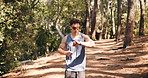 Smart watch, exercise and man in forest, running performance and digital app to track progress. Training, runner or person in woods, fitness and cardio workout with challenge, monitor time or results