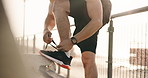 Hands, athlete and tie laces in city for fitness, endurance training and running preparation. Person, runner and exercise safety with footwear, getting ready and sports workout for wellness outdoor