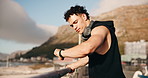 Fitness, thinking and man with headphones outdoor for training, exercise and workout for wellness. Rest, reflection and person on break with music, audio and radio for challenge, endurance and run