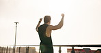 Athlete, celebration and man with fist pump at beach, running and happiness for exercise achievement. Runner, space and person with smile for workout success, back and clapping for fitness in nature