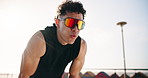 Outdoor, thinking and man with exercise, tired and sweating with break, reflection and wellness. Fitness, athlete or person with workout for health benefits, exhausted or challenge with breathing