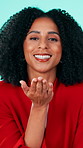 Happy woman, face and blowing with kiss for love, care or valentines day on a studio background. Portrait, female person or model with smile or romantic gesture for romance, admiration or devotion