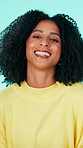 Face, funny and woman in studio, smile and positive energy on blue background. Happiness, freedom and person with joy, fun and humor with joke, comedy and comic with confidence, reaction and pride