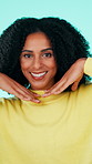 Face, smile and woman with hands for frame, expression and excited on blue studio background. Happiness, gesture and person with confidence, pride and perspective for photography and profile picture
