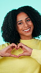 Heart hands, face or woman with happiness, friendly symbol and compassion on studio background. Love, portrait and female person with care emoji, positive gesture and support in kindness icon.