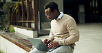 Laptop, typing and black man outdoor in city with research for finance report for budget plan. Glasses, computer and African male financial manager with email for investment proposal in urban town.