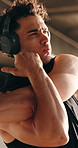 Man, fitness and stretching arms with headphones for workout preparation or exercise. Active, male person or getting ready with body warm up or music app for outdoor training or physical activity