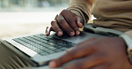 Laptop, city and hands of business man outdoor for internet, financial proposal and research. Professional, keyboard and person scroll on computer for finance report, deadline and project in town