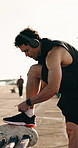 Headphones, man or tie shoes for fitness to start cardio, workout preparation or music in city. Runner, person or fasten sneakers outdoor for morning jog, exercise comfort or getting ready with radio