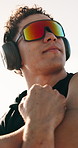Man, fitness and stretching arms with headphones for workout preparation or outdoor exercise. Active, male person or getting ready with neck warm up or sunglasses for physical activity or training