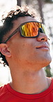 Exercise, man and exploring forest with sunglasses for workout break, route scenery and low angle. Flare, athlete and view of woods with eyewear for fitness rest, nature appreciation and sightseeing