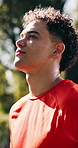 Thinking, man and exercise in nature, rest and challenge for health benefits, breathing and wellness. Outdoor, athlete and person with break, progress and fitness with reflection, workout or sunshine