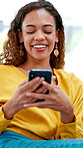 Woman, relax and laugh on sofa with phone, funny social media video and check for text message joke. Happy, person and browsing in home with tech, online meme and mobile app for comedy entertainment.