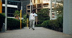 Walking, city and business man with watch in street for morning commute, travel and journey schedule. Pedestrian, corporate and African person check time for work, career and trip to office in town