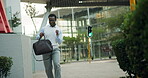 Dancing, happy and black man in city on commute for promotion, job opportunity and success. Corporate, professional and excited person in urban town for celebration, business achievement and victory