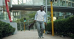 Dance, happy and black man in city on commute for promotion, job opportunity and success. Corporate, professional and excited person in urban town for celebration, business achievement and victory