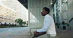 Black man, bus stop and travel with bag in city for transportation service or commute. Businessman, traveler or waiting with luggage at public station or sidewalk for ride or lift in an urban town