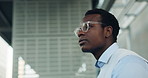 Phone, waiting and black man in city for lift, taxi and transportation to workplace. Business person, hailing app and impatient with schedule, commute and booking for travel service in urban town