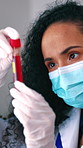 Scientist, mask and woman in test tube for blood inspection,  research or medical innovation. Science, ppe and person in lab for hematology, investigation and study dna sample for clinical chemistry