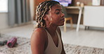 Yoga, stretching and black woman in home, cobra pose for health benefits or energy. Apartment, yogi and African person in lounge, fitness and exercise for peace, morning routine and movement on floor