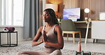 Yoga, floor and black woman with prayer hands for meditation, mindfulness and balance. Home, morning and person stretching arms for holistic healing, wellness and breathing exercise in living room