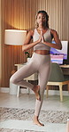Fitness, stretching and black woman with yoga in house, holistic health and balance activity for practice. Active, pilates routine and person with tree pose for wellness, posture exercise and calm