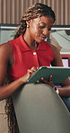 Black woman, remote work and typing with tablet for website, research and positive feedback. Freelancer, graphic designer and tech in home office with thinking, design process or proposal planning
