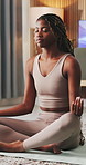 Black woman, breathe and meditation for yoga in home with chakra, inner peace and mindfulness. Female person, lotus pose and inhale for wellness, spiritual healing and self care with holistic balance