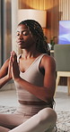 Black woman, namaste and meditate for yoga in home with chakra, inner peace and mindfulness. Female person, inhale and prayer hands for wellness, spiritual healing and self care with holistic balance