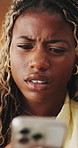 Frustrated, stress and black woman in home, smartphone for online announcement and bad news. Upset, mobile user and African person with reaction, confused and message to contact, unhappy and internet