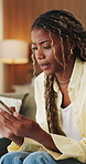 Frustrated, thinking and black woman in home, smartphone for online announcement and upset. Pressure, mobile user and African person with reaction, confused and message to contact, unhappy and app