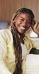 Laugh, relax and face of black woman on sofa of home for peace, confidence and wellness. Happiness, pride and weekend break with person in living room of apartment for calm, free time and joke