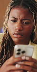 Confused, stress and black woman in home, smartphone for online announcement and bad news. Upset, anxiety and African person with reaction, frustrated and message to contact, unhappy and internet